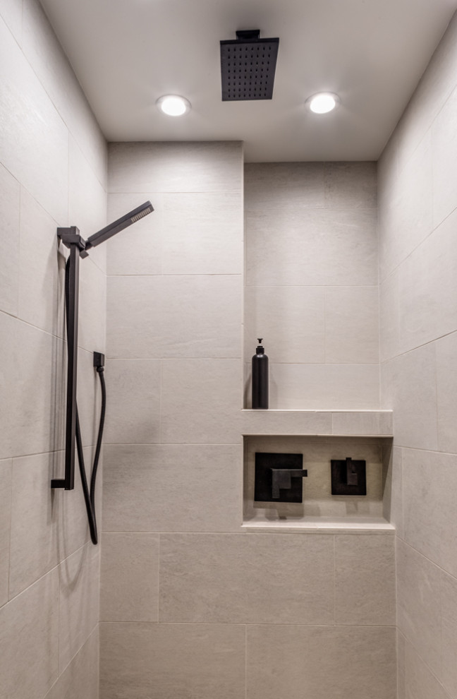 Example of a small urban master white tile and porcelain tile porcelain tile and white floor corner shower design in Las Vegas with medium tone wood cabinets, a one-piece toilet, white walls, a vessel sink, quartzite countertops, a hinged shower door and gray countertops