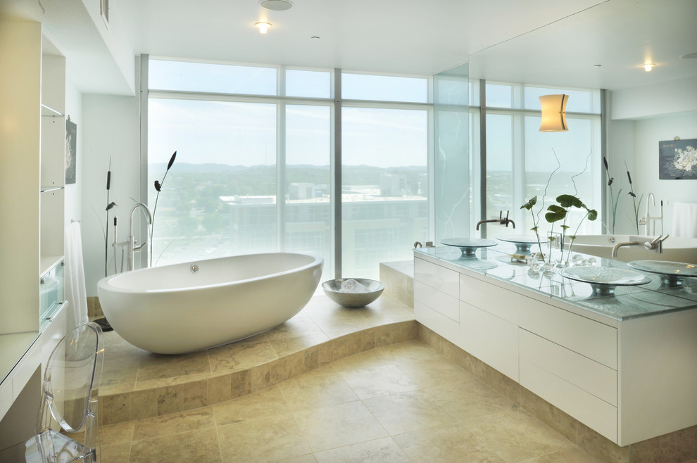 Trendy freestanding bathtub photo in Nashville with a vessel sink