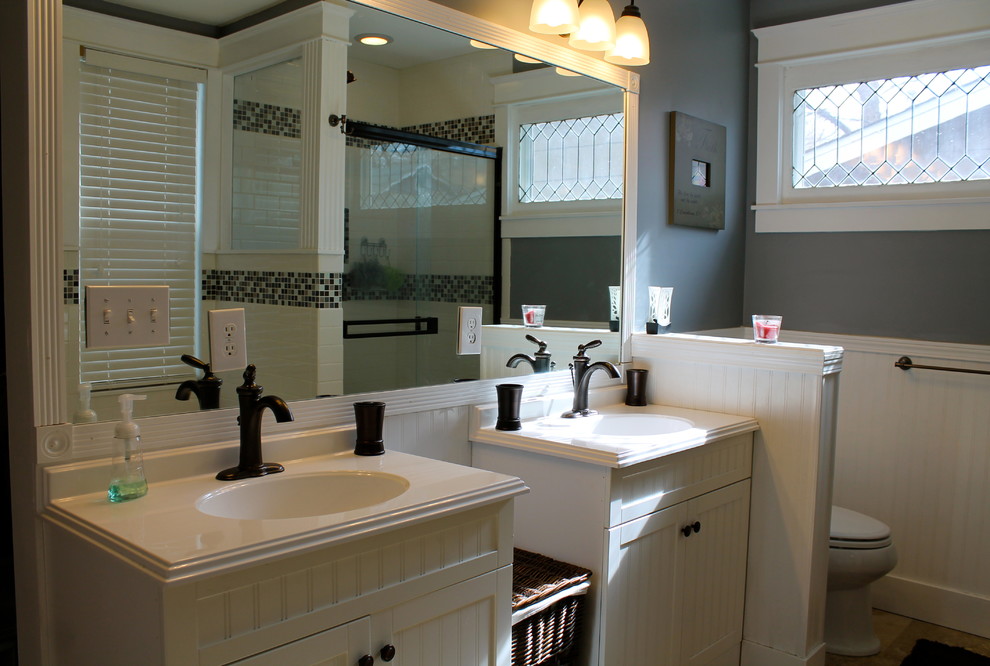 Example of a mid-sized classic white tile and ceramic tile travertine floor bathroom design in Denver with an integrated sink, white cabinets, a two-piece toilet and blue walls