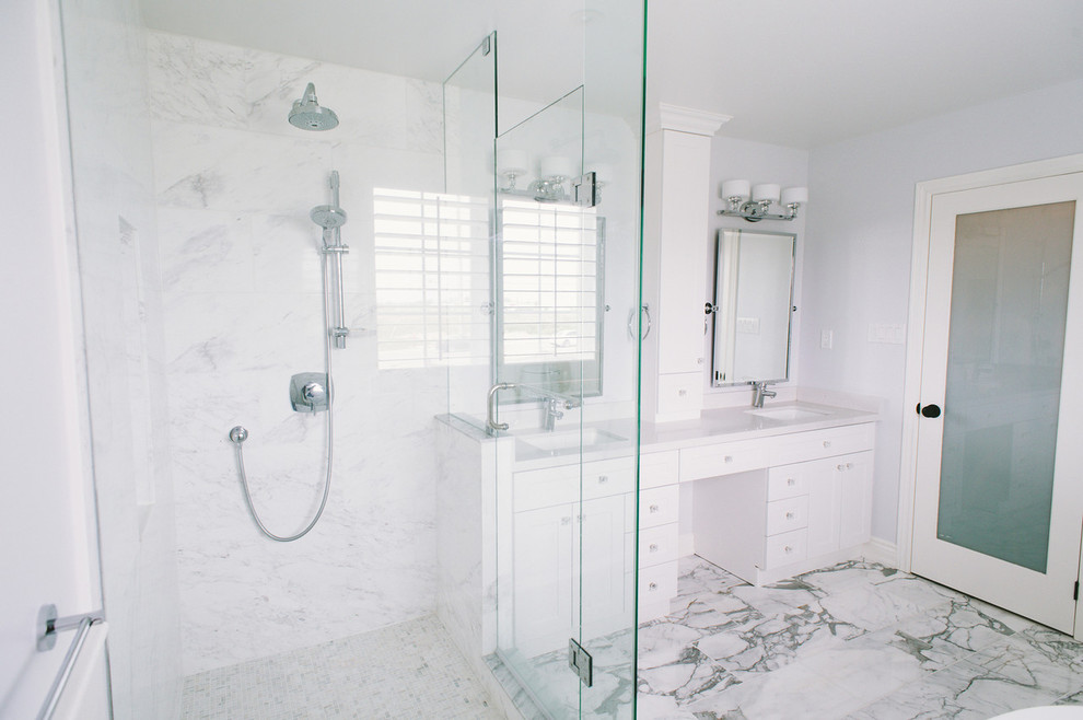 Inspiration for a large classic ensuite bathroom in Toronto with a submerged sink, shaker cabinets, white cabinets, engineered stone worktops, a freestanding bath, a corner shower, a one-piece toilet, white tiles, stone tiles, blue walls and marble flooring.