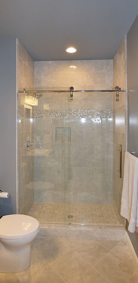 Photo of a large classic ensuite bathroom in Philadelphia with white cabinets, a freestanding bath, a walk-in shower, a one-piece toilet, multi-coloured tiles, mosaic tiles, beige walls, ceramic flooring, a submerged sink and granite worktops.