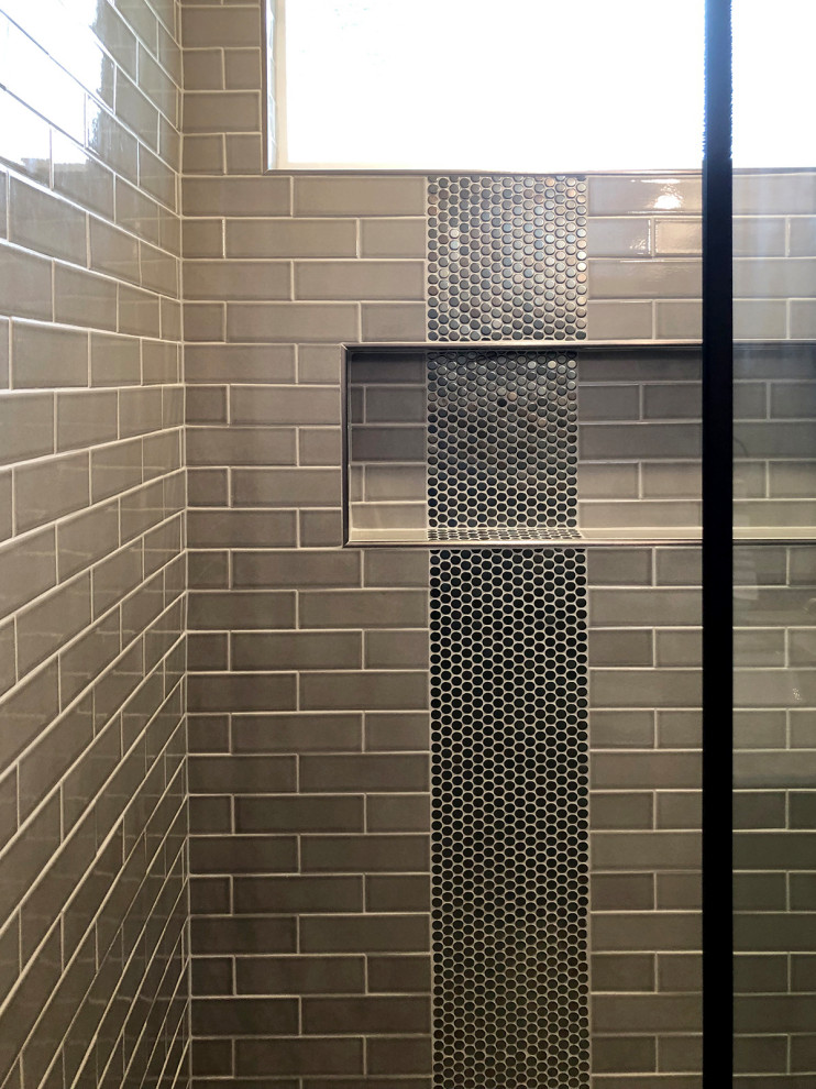 Example of a small urban brown tile and subway tile porcelain tile and multicolored floor bathroom design in Dallas with shaker cabinets, black cabinets, a one-piece toilet, gray walls, an undermount sink, marble countertops and white countertops