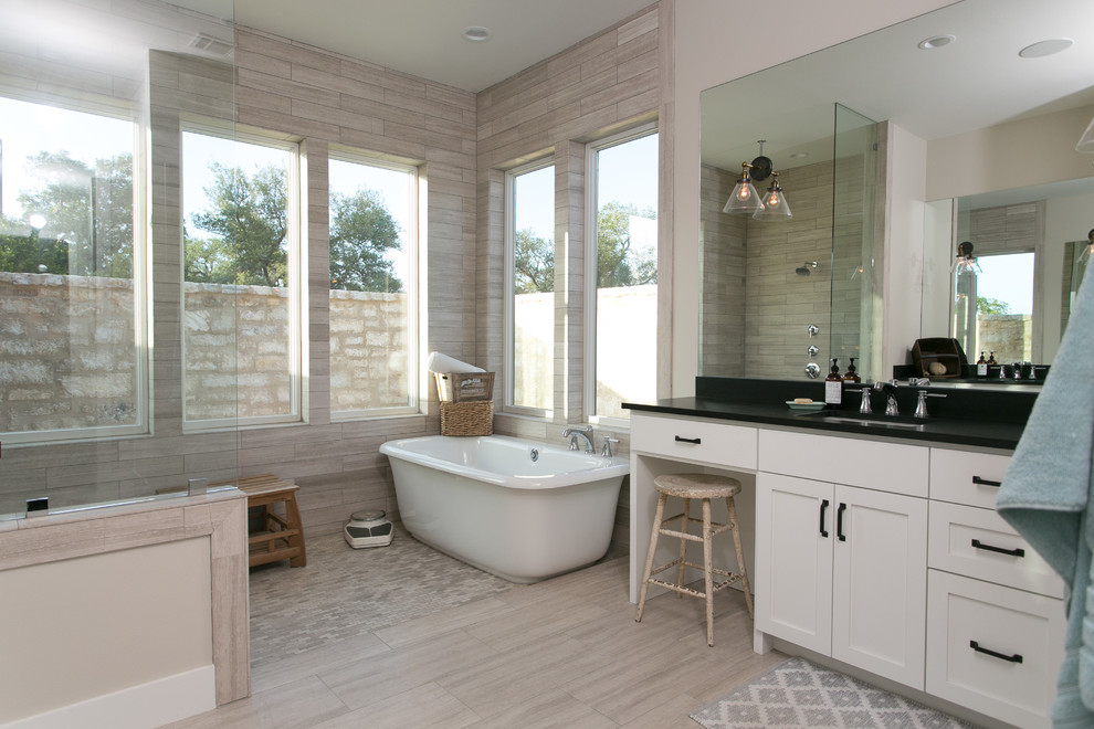 Design ideas for a country ensuite bathroom in Austin with shaker cabinets, white cabinets, beige walls, porcelain flooring, a built-in sink, granite worktops and grey floors.