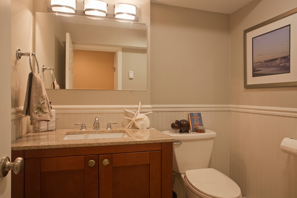 Small beach style bathroom photo in Boston with an undermount sink, shaker cabinets, medium tone wood cabinets, a two-piece toilet and green walls