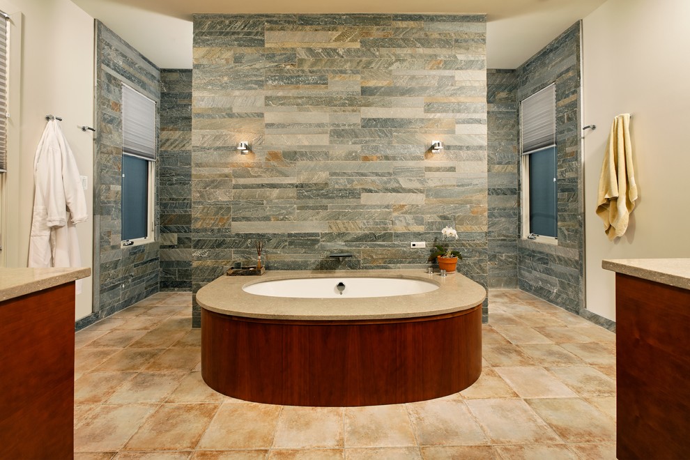 Large traditional ensuite bathroom in DC Metro with stone tiles, flat-panel cabinets, dark wood cabinets, a built-in bath, a built-in shower, beige tiles, grey tiles, beige walls, ceramic flooring, a submerged sink, quartz worktops, beige floors and an open shower.