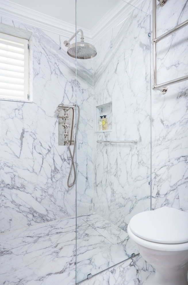 Medium sized traditional shower room bathroom in London with open cabinets, a walk-in shower, a one-piece toilet, white tiles, stone slabs, white walls, marble flooring, a console sink and marble worktops.