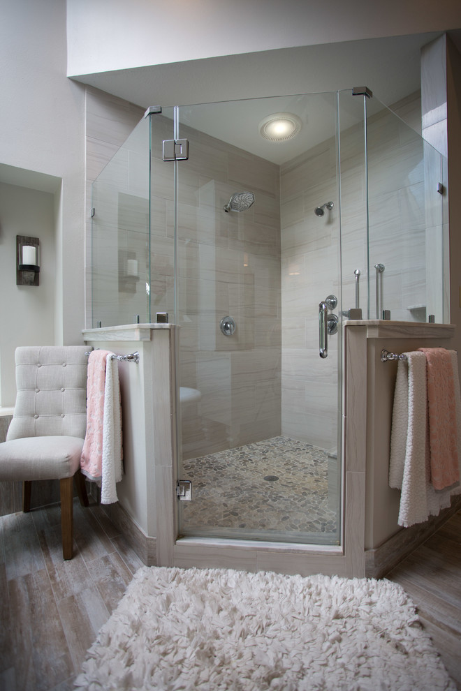 Inspiration for a large farmhouse ensuite bathroom in Houston with recessed-panel cabinets, white cabinets, a claw-foot bath, a corner shower, a one-piece toilet, beige tiles, porcelain tiles, beige walls, porcelain flooring, a submerged sink, concrete worktops, beige floors and a hinged door.