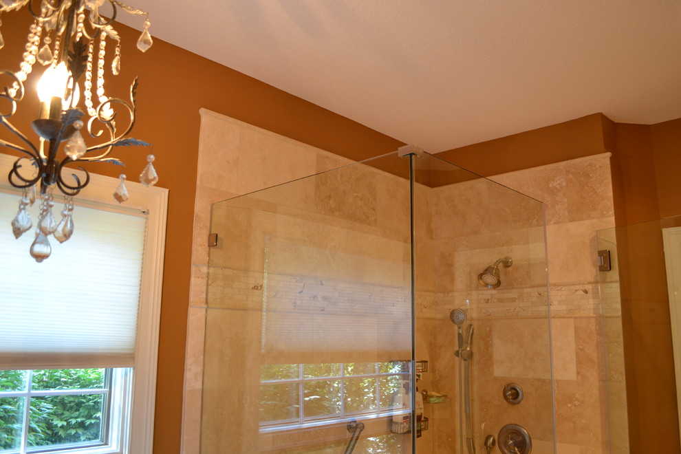 Small tuscan master beige tile and stone tile ceramic tile bathroom photo in Columbus with recessed-panel cabinets, black cabinets, a two-piece toilet, beige walls and an integrated sink