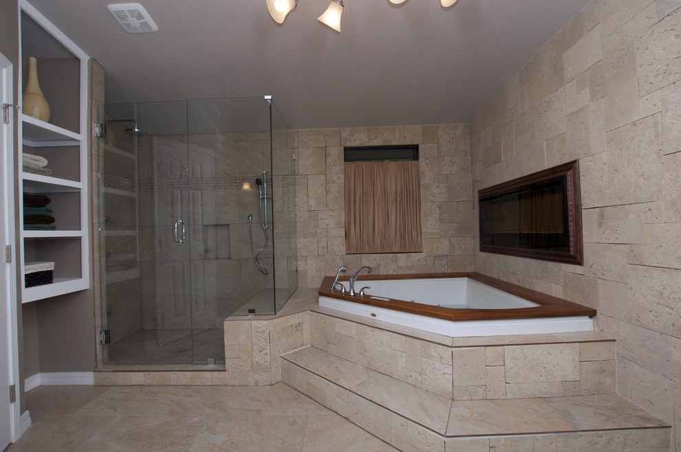 Large elegant master stone tile limestone floor alcove shower photo in Other with a hot tub, a two-piece toilet, beige walls, a wall-mount sink and solid surface countertops