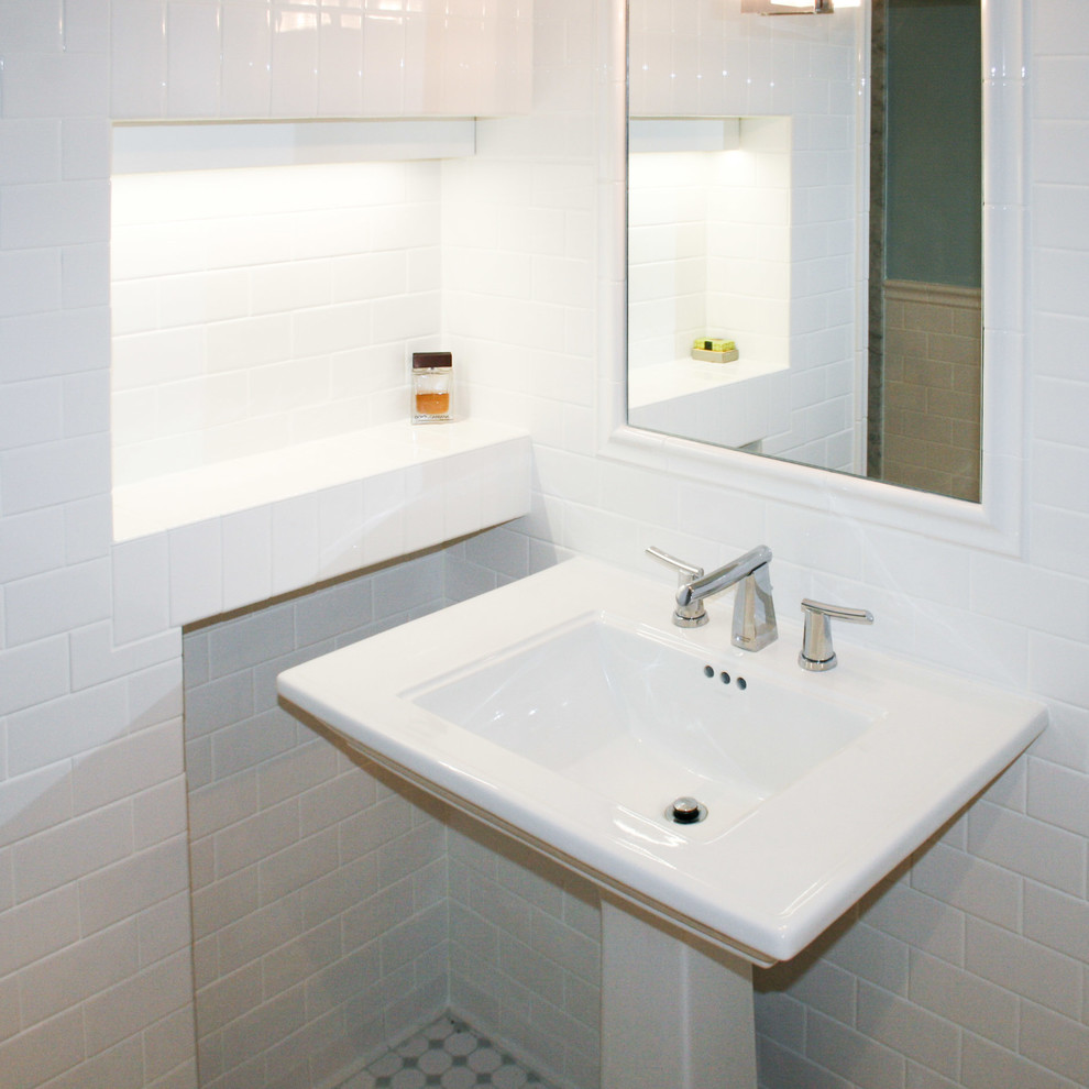 This is an example of a small classic bathroom in Toronto with a pedestal sink, an alcove shower, a two-piece toilet, white tiles, metro tiles, blue walls and porcelain flooring.