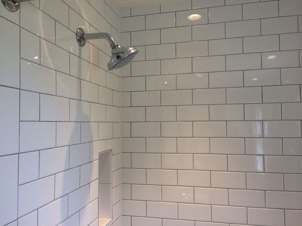 Design ideas for a medium sized classic shower room bathroom in Omaha with open cabinets, an alcove bath, a shower/bath combination, white tiles, metro tiles, grey walls, porcelain flooring, a submerged sink, engineered stone worktops, black floors and a shower curtain.