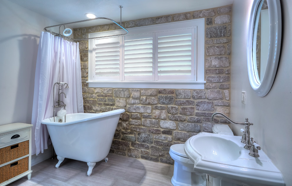 Example of a small cottage chic kids' gray tile and porcelain tile porcelain tile bathroom design in Tampa with white cabinets, a one-piece toilet, gray walls, a pedestal sink and furniture-like cabinets