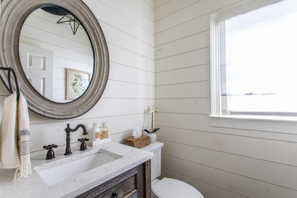 Single-sink and shiplap wall bathroom photo in Atlanta with dark wood cabinets, white walls, an undermount sink and a built-in vanity