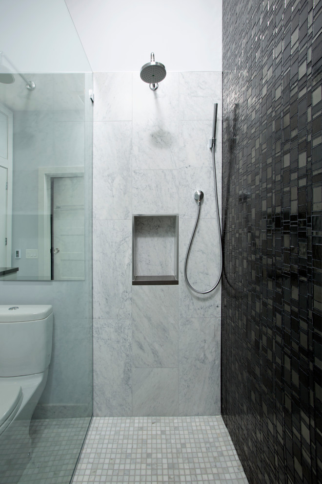 Alcove shower - mid-sized contemporary 3/4 black tile, gray tile, white tile and stone tile marble floor alcove shower idea in DC Metro with flat-panel cabinets, gray cabinets, solid surface countertops, a one-piece toilet, an undermount sink and gray walls