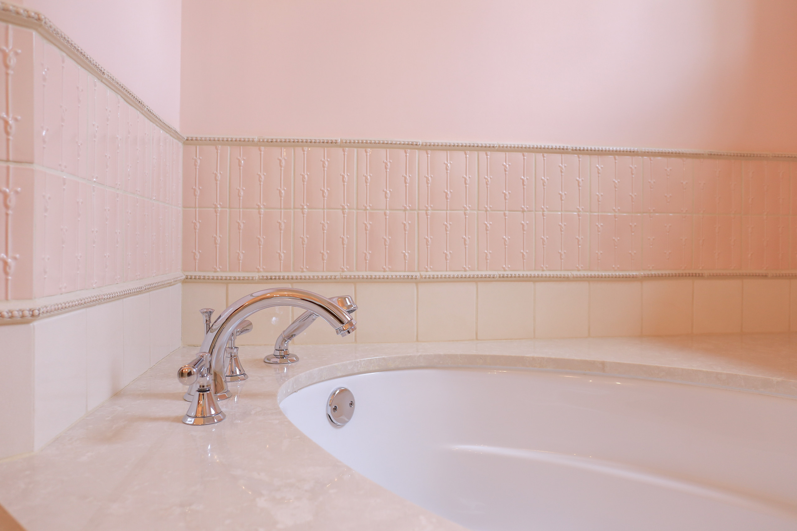 Pink bathroom with marble walls and floor, pink crystals and gold details  on Craiyon