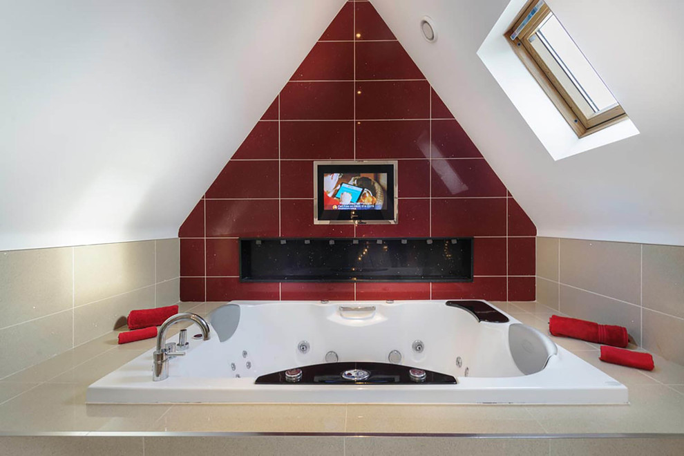 This is an example of a small contemporary ensuite bathroom in Other with a submerged bath, beige tiles and red tiles.