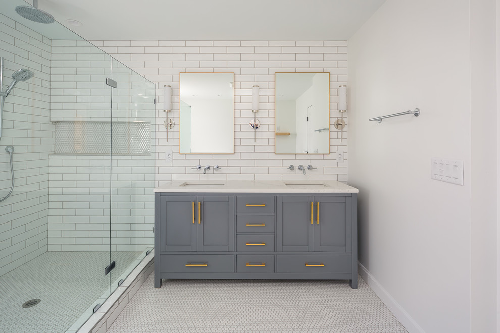Large trendy master white tile and subway tile mosaic tile floor and white floor double shower photo in Raleigh with shaker cabinets, gray cabinets, white walls, an undermount sink, a hinged shower door and white countertops