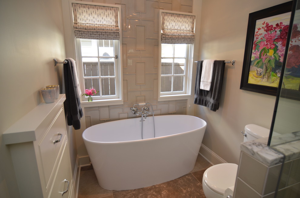 Design ideas for a medium sized traditional bathroom in Portland with a submerged sink, beaded cabinets, grey cabinets, marble worktops, a freestanding bath, grey tiles, ceramic tiles, grey walls and limestone flooring.