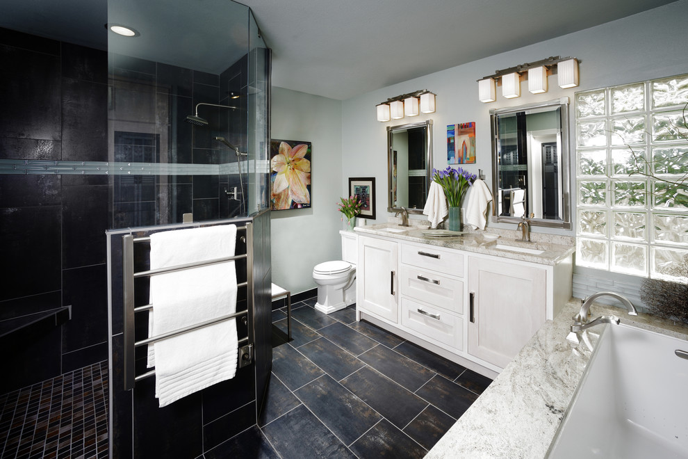 Example of a mid-sized classic master black tile and porcelain tile porcelain tile bathroom design in Other with a drop-in sink, shaker cabinets, white cabinets, blue walls, a two-piece toilet and marble countertops