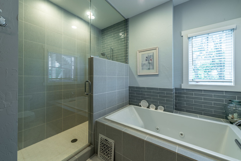 Example of a mid-sized mountain style master ceramic tile and multicolored floor bathroom design in Milwaukee with beaded inset cabinets, light wood cabinets, a two-piece toilet, gray walls, a trough sink, quartz countertops, a hinged shower door and gray countertops