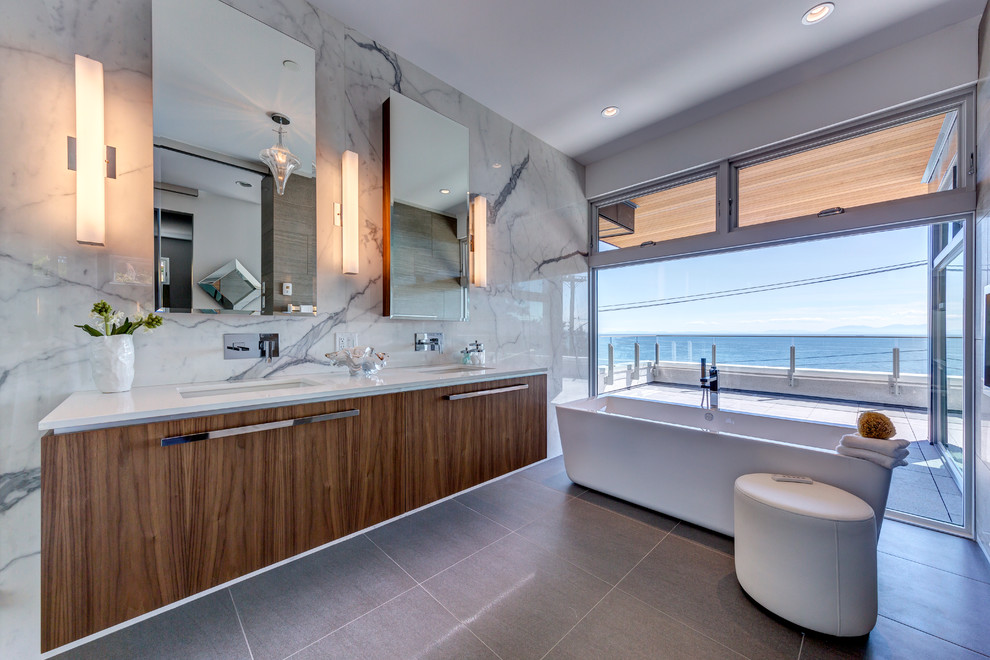 Inspiration for a large contemporary master white tile and porcelain tile porcelain tile bathroom remodel in Vancouver with flat-panel cabinets, medium tone wood cabinets, a wall-mount toilet, white walls, an undermount sink and quartz countertops