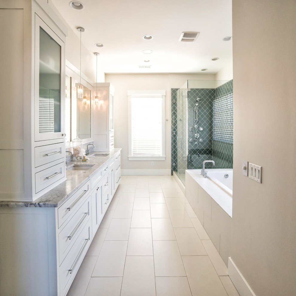 Photo of a large classic ensuite bathroom in Other with flat-panel cabinets, white cabinets, a built-in bath, a walk-in shower, white tiles, ceramic tiles, grey walls, ceramic flooring, a submerged sink and marble worktops.