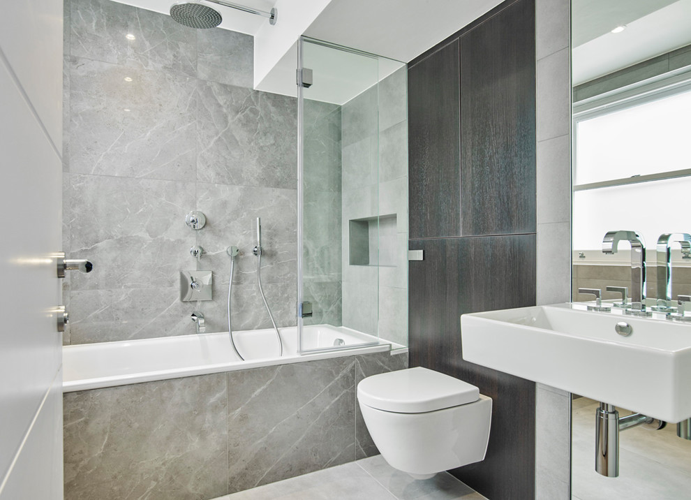 Photo of a medium sized contemporary family bathroom in London with a built-in bath, grey tiles, porcelain tiles, porcelain flooring and grey floors.