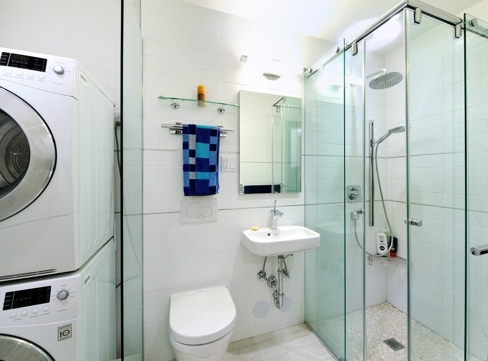 This is an example of a medium sized modern ensuite bathroom in New York with a console sink, solid surface worktops, a corner shower, white tiles, ceramic tiles, white walls and ceramic flooring.