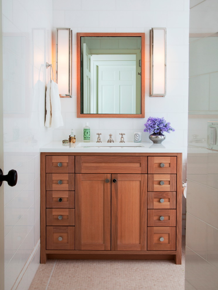 Inspiration for a small transitional master white tile mosaic tile floor bathroom remodel in New York with an undermount sink, shaker cabinets, medium tone wood cabinets and white walls