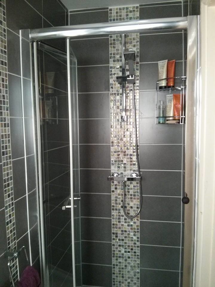 Design ideas for a small contemporary shower room bathroom in Essex with a wall-mounted sink, beaded cabinets, an alcove shower, a two-piece toilet, grey tiles, ceramic tiles, grey walls and mosaic tile flooring.