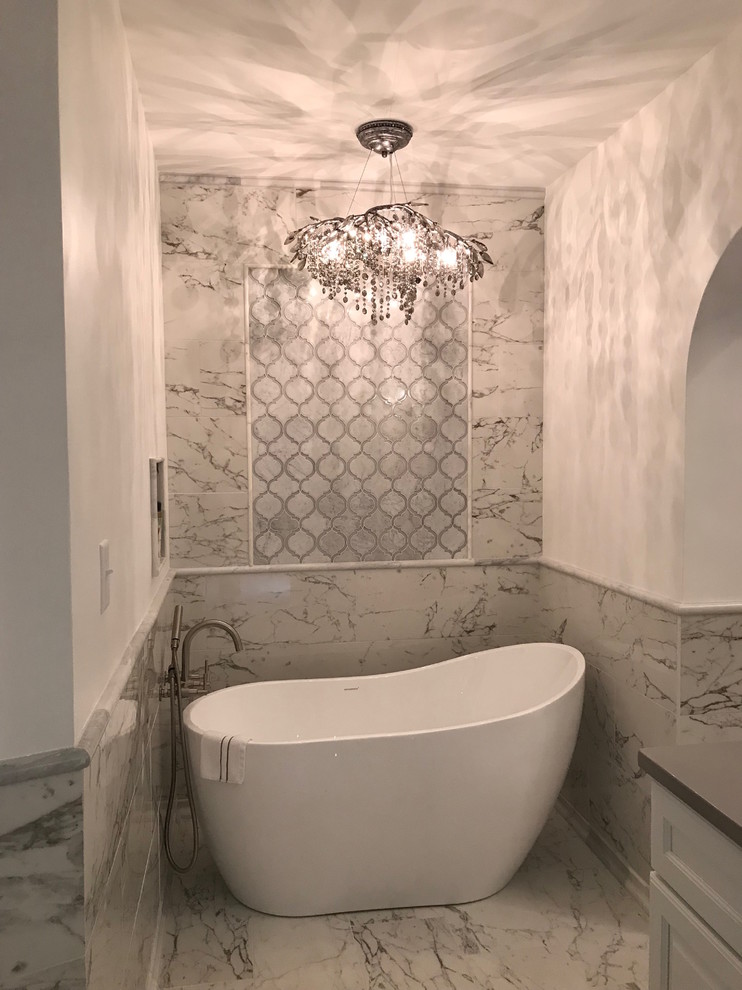 Design ideas for a large contemporary ensuite bathroom in Atlanta with shaker cabinets, white cabinets, a freestanding bath, a double shower, a one-piece toilet, black and white tiles, mosaic tiles, white walls, marble flooring, a console sink, engineered stone worktops, white floors, a hinged door and grey worktops.