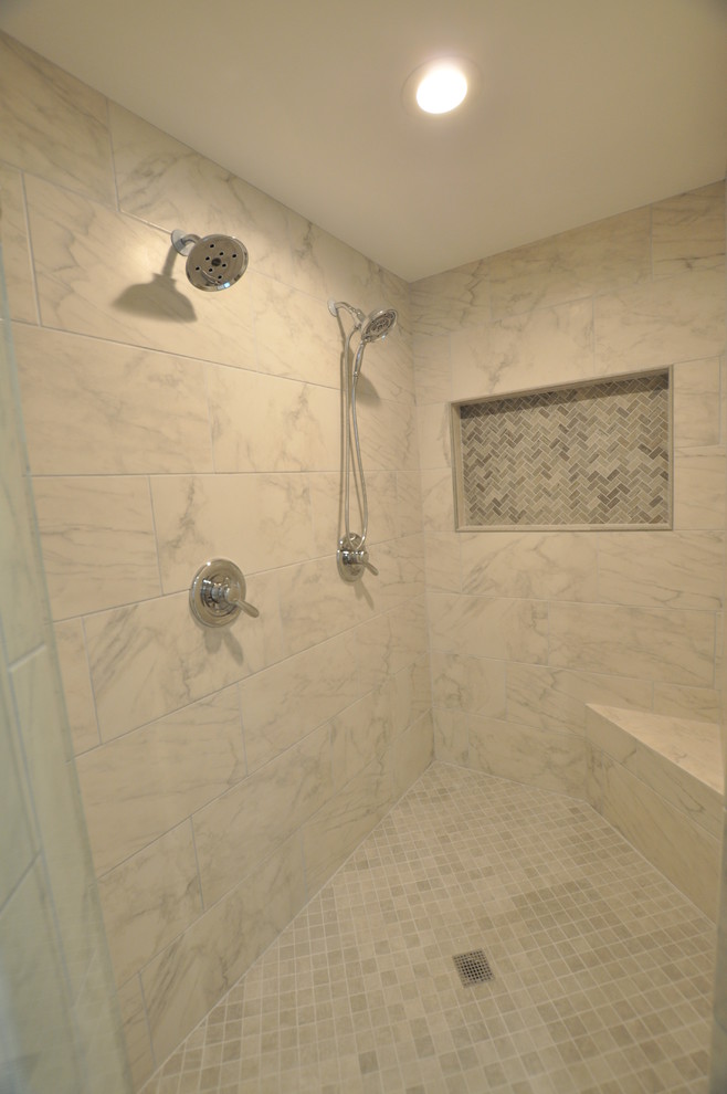 Bathroom - mid-sized transitional master gray tile, white tile and stone tile beige floor bathroom idea in Atlanta with shaker cabinets, dark wood cabinets, gray walls, an undermount sink, quartzite countertops and a hinged shower door