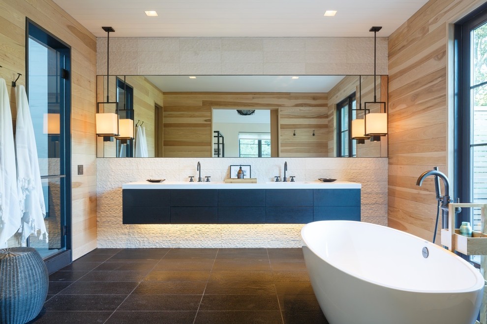 Mid-sized minimalist master white tile and stone tile light wood floor and black floor bathroom photo in New York with flat-panel cabinets, dark wood cabinets, a one-piece toilet, white walls, an undermount sink, solid surface countertops, a hinged shower door and white countertops