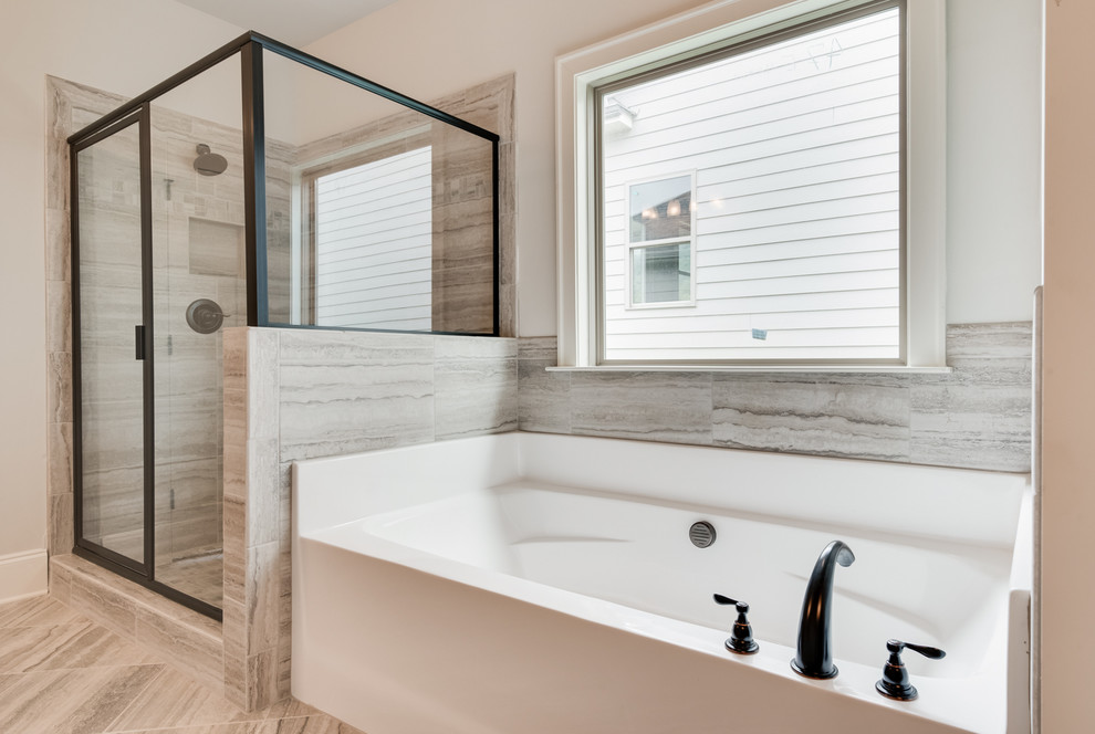 Example of a mid-sized transitional master gray tile and porcelain tile porcelain tile and gray floor bathroom design in Other with recessed-panel cabinets, white cabinets, gray walls, an undermount sink, granite countertops and a hinged shower door