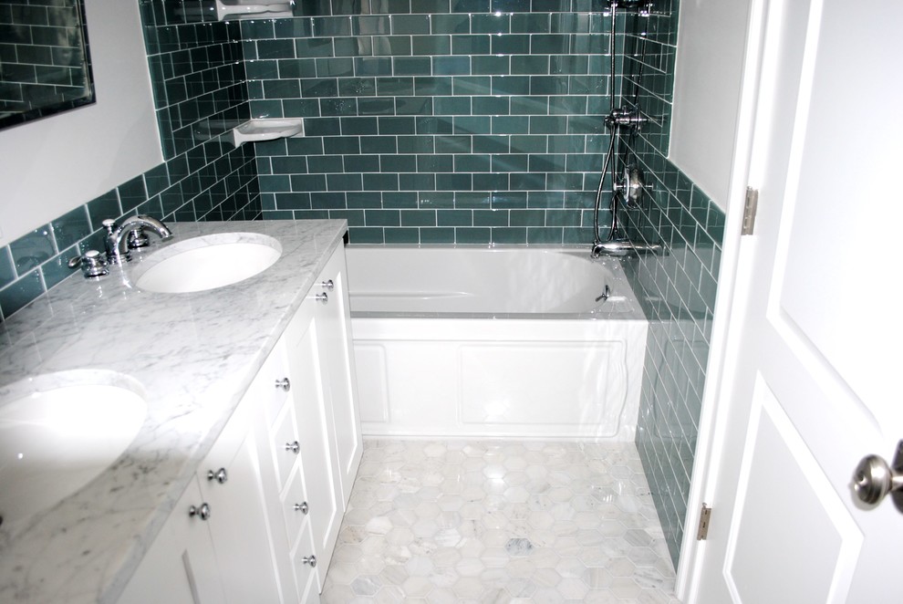 Example of a mid-sized classic kids' green tile and glass tile ceramic tile bathroom design in New York with an undermount sink, raised-panel cabinets, white cabinets, wood countertops, a one-piece toilet and white walls