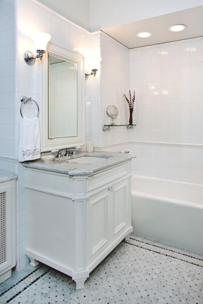 Small elegant master white tile and ceramic tile marble floor bathroom photo in Chicago with an undermount sink, recessed-panel cabinets, white cabinets, marble countertops and gray walls