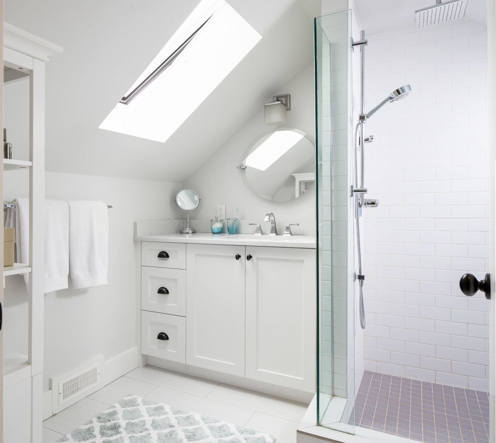 Example of a small transitional white tile and subway tile white floor corner shower design in Vancouver with shaker cabinets, white cabinets, an undermount sink and white countertops