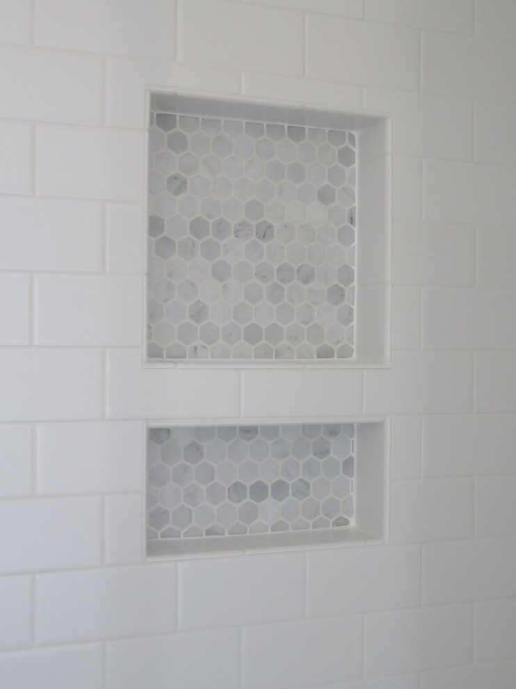 This is an example of a farmhouse bathroom in Baltimore with metro tiles.