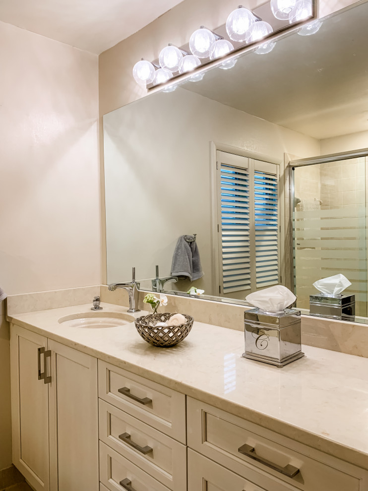 Example of a mid-sized transitional master beige tile and ceramic tile ceramic tile, beige floor and single-sink bathroom design in DC Metro with recessed-panel cabinets, white cabinets, a one-piece toilet, beige walls, an undermount sink, marble countertops, beige countertops and a built-in vanity