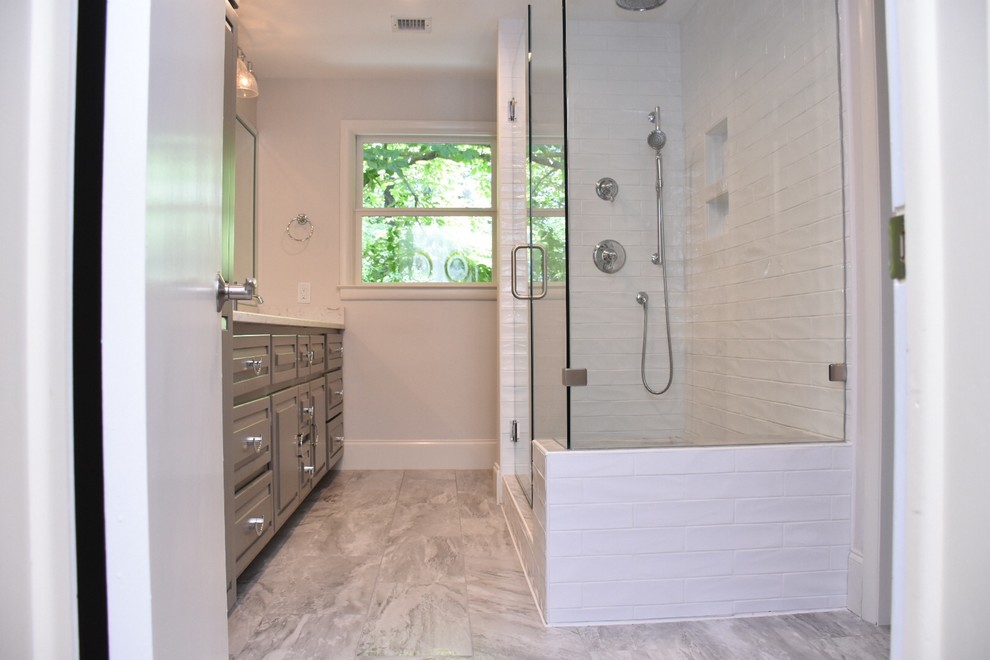 Inspiration for a medium sized classic ensuite bathroom in Other with raised-panel cabinets, grey cabinets, an alcove shower, a two-piece toilet, white tiles, metro tiles, white walls, ceramic flooring, a submerged sink, quartz worktops, green floors and a hinged door.
