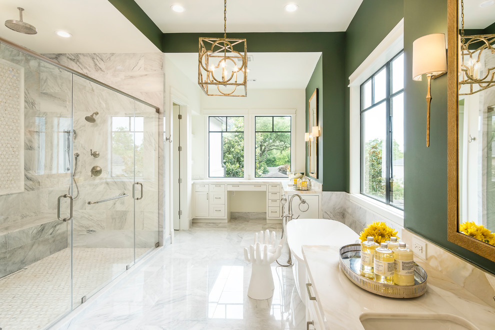 Transitional master white tile white floor freestanding bathtub photo in Houston with white cabinets, green walls, an undermount sink and white countertops