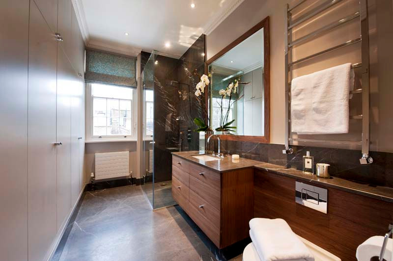 Design ideas for a small contemporary ensuite bathroom in London with a built-in shower, a wall mounted toilet, ceramic flooring, a wall-mounted sink, a hinged door, a single sink and a floating vanity unit.