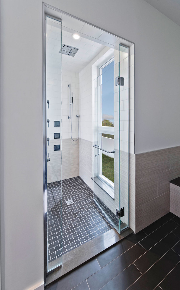 This is an example of a modern bathroom in Ottawa with an alcove shower and grey tiles.