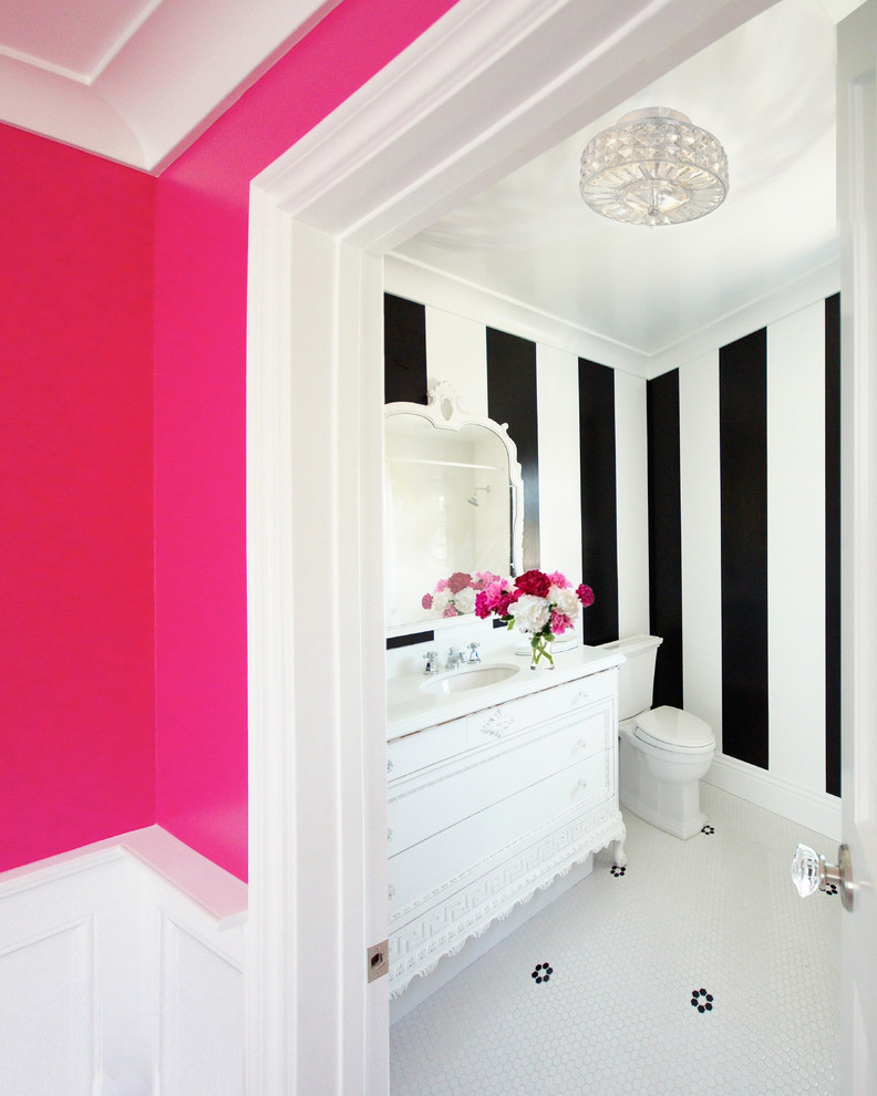 Bathroom - mid-sized eclectic 3/4 ceramic tile and white floor bathroom idea in Austin with furniture-like cabinets, white cabinets, a one-piece toilet, black walls, an integrated sink and white countertops