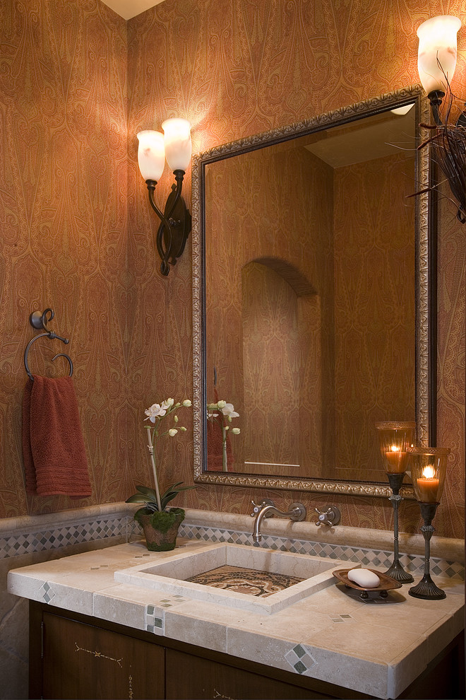 На фото: ванная комната в стиле фьюжн с накладной раковиной, столешницей из плитки и оранжевыми стенами с