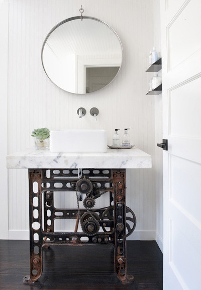 This is an example of a medium sized eclectic shower room bathroom in San Francisco with open cabinets, a one-piece toilet, white walls, dark hardwood flooring, a vessel sink and marble worktops.