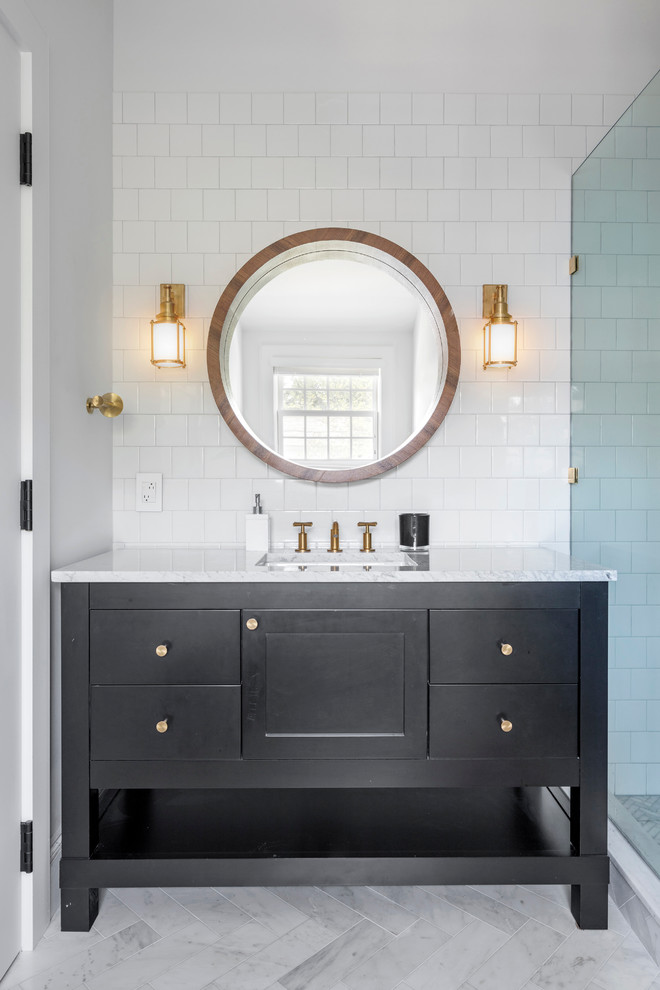 Mid-sized eclectic marble floor corner bathtub photo in Boston with shaker cabinets, gray cabinets, white walls, an undermount sink and marble countertops