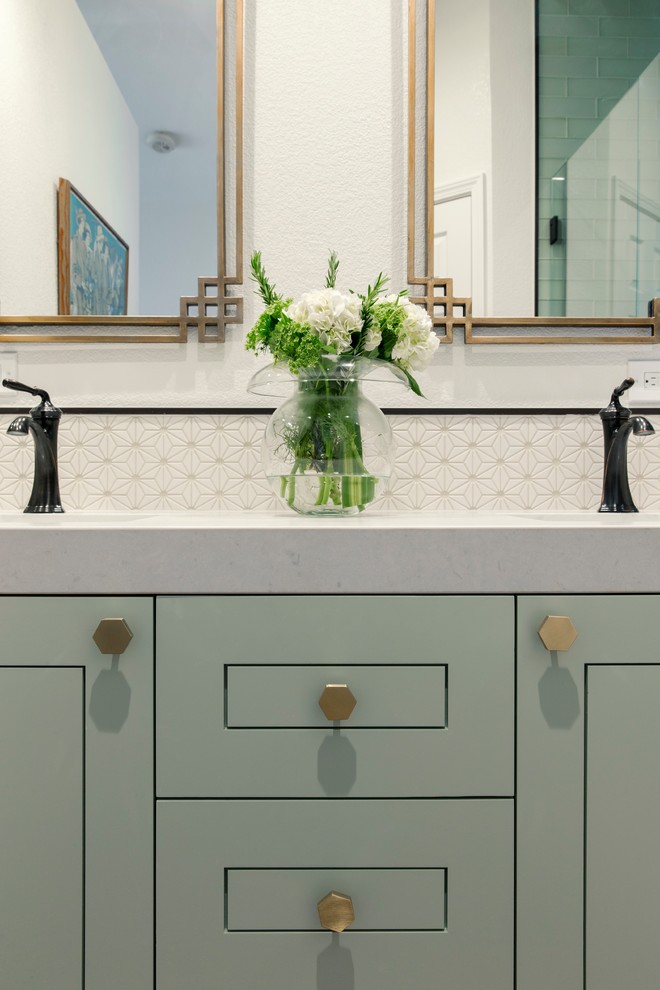 Example of a small eclectic master bathroom design with flat-panel cabinets and blue cabinets