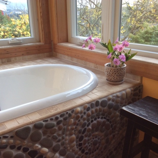 Design ideas for a medium sized bohemian ensuite bathroom in Seattle with a built-in bath, multi-coloured tiles, mosaic tiles, brown walls and tiled worktops.