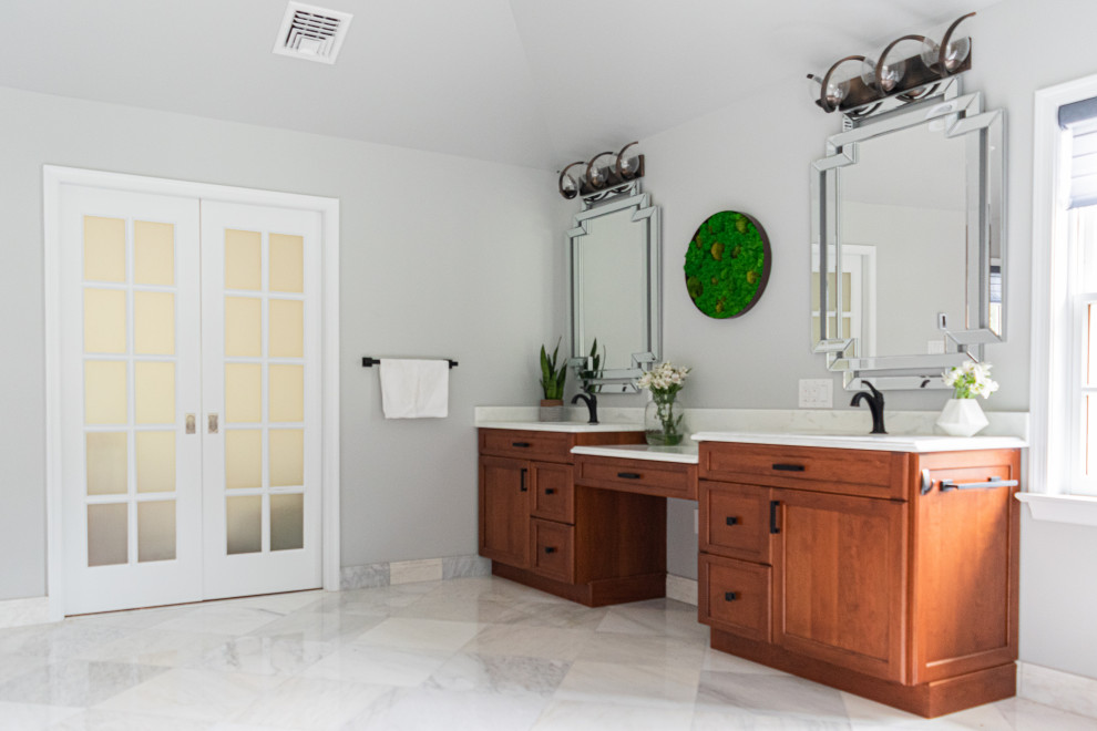 Bathroom - large master brown tile marble floor, white floor, double-sink, vaulted ceiling and wood wall bathroom idea in Philadelphia with medium tone wood cabinets, a bidet, gray walls, an undermount sink, quartzite countertops, a hinged shower door, white countertops and a built-in vanity